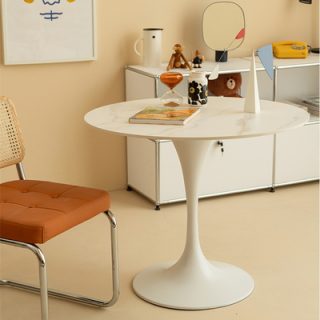 Round Eames dining table with modern minimalist design
