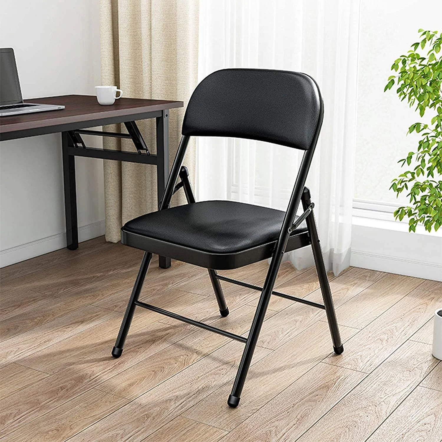 Black foldable office seat with a space-saving design for flexible office and meeting areas in Nairobi, Kenya.